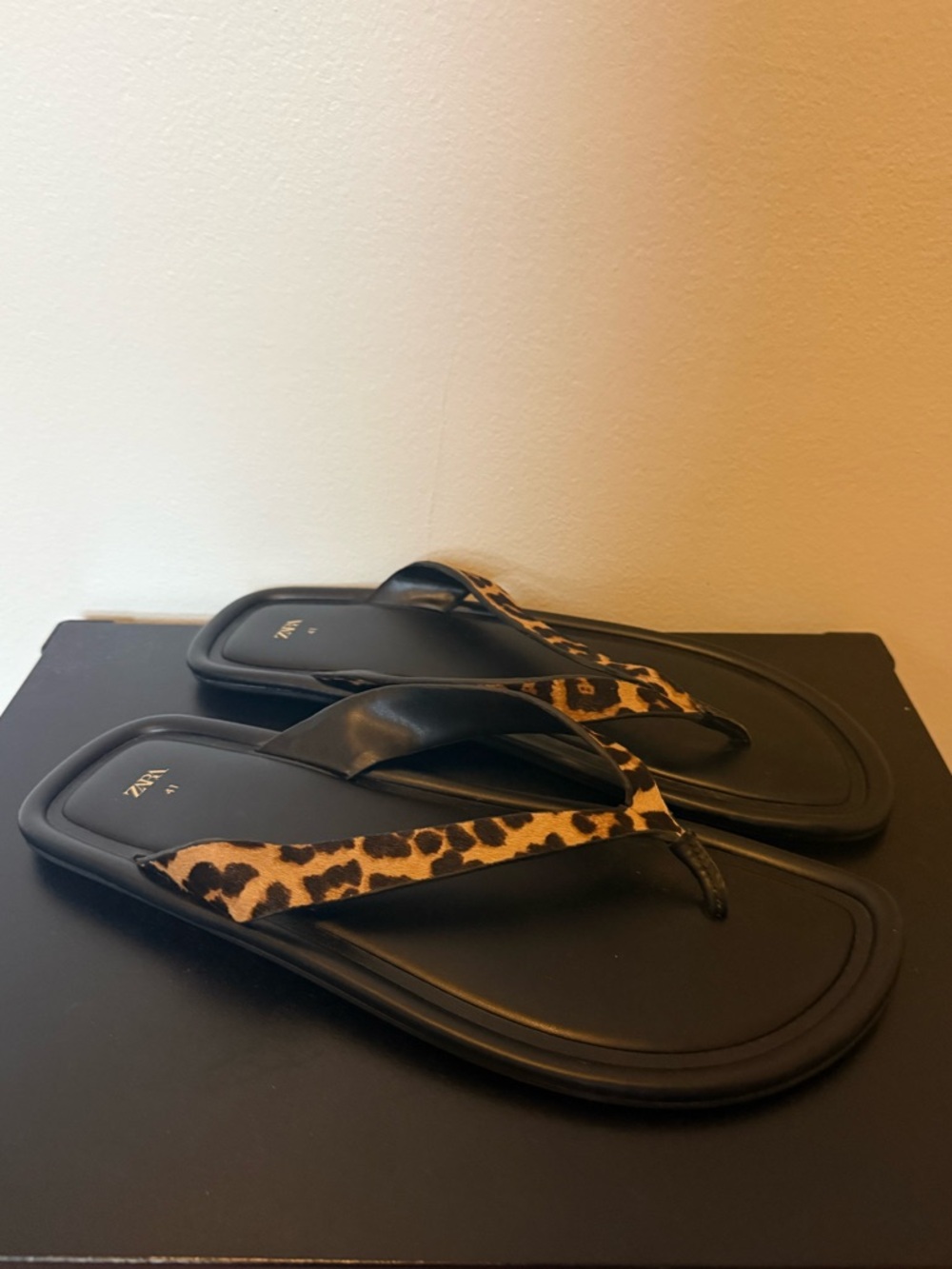 Animal print leather flip flops